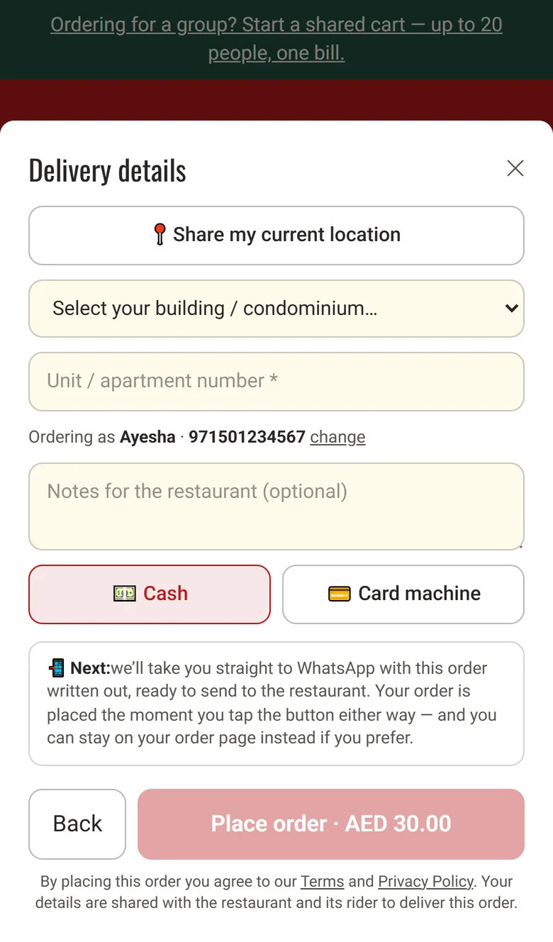 The checkout's delivery details: a map pin, a building picker and a unit number field